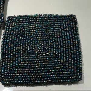 Set of 8 beaded iridescent blue coasters.  Mint condition, size 4” square.  Nice